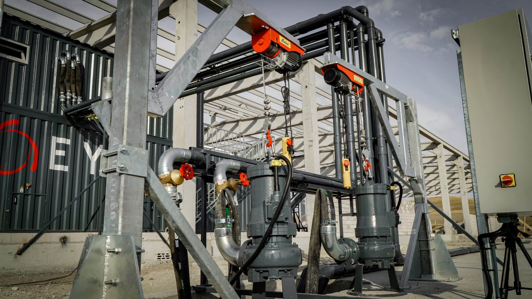Industrial agricultural equipment with pipes and machinery at Agri-Pro.