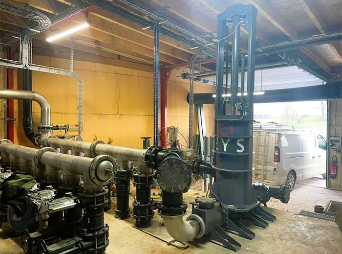 Industrial piston pump setup at Agri-Pro for irrigation and water management.